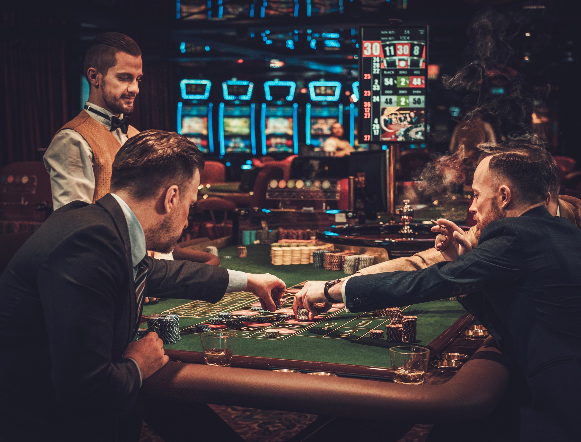 Upper class friends gambling in a casino